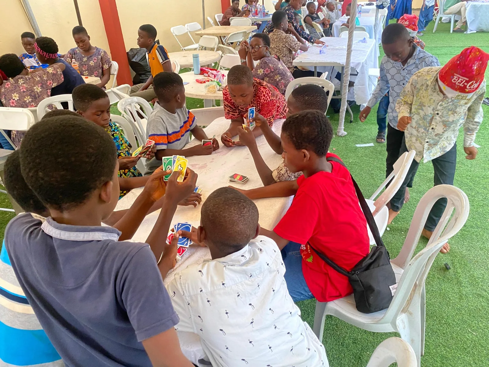 Children gathered around a table during the celebration.